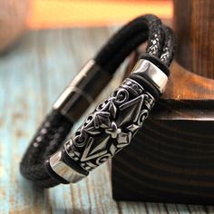 Bohemian, elegant and modern men's bracelet. Handcrafted double rope bracelet with cross connector and magnetic closure in stainless steel and black waxed snake leather. The bracelet is 12 mm wide leather. Available in two colors (black and brown). This is the perfect gift for someone you love. SHIPPING: Free domestic shipping on orders of $35.00 or more, USPS Ground Advantage shipping only. Slowest delivery is estimated at 11 business days MATERIALS  * Black waxed snake leather Cord 6 mm * Stai Men's Leather Bracelet, Bangle Jewelry, Snake Leather, Mens Crosses, Stainless Steel Bangles, Mens Leather Bracelet, Bracelet Cuff, Bracelet For Men, Bangles Jewelry