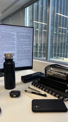 a computer monitor sitting on top of a desk next to a keyboard and mouses