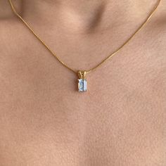 Our gorgeous Blue Topaz rectangular pendant necklace in 18K gold plated plated on sterling silver is the perfect addition to your jewellery collection. Pair this premium, yet affordable blue gemstone necklace with your everyday outfits to add a touch of style and luxury to your look. LOOK AND FEEL Carigari is committed to providing you with the same premium feeling of some of the biggest names in the industry for an affordable price tag. All our product pictures are unedited and unfiltered, shot under natural light with an iPhone 11. What you see is what you get! MEASUREMENTS Chain length: 15inches Gemstone size: 12mm by 8mm MATERIALS A responsibly sourced blue Topaz is paired with an 18k gold vermeil chain to create a minimal, yet gorgeous design with a premium feel. Note: All our gold pl Blue Gemstone Necklace, Rectangle Pendant, Square Necklace, Blue Topaz Necklace, Topaz Necklace, Blue Gemstones, Product Pictures, Topaz Gemstone, Jewellery Collection