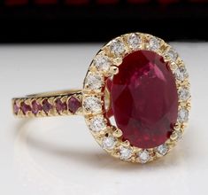 Luxury Yellow Gold Ruby Ring Oval Cabochon, Luxury Gold Domed Ruby Ring, Luxury Ruby Halo Wedding Ring, Luxury Ruby Halo Setting Wedding Ring, Luxury Ruby Wedding Ring With Halo Setting, Fine Jewelry Gold Ruby Ring Gia Certified, Elegant Gia Certified Gold Ruby Ring, Gold Gia Certified Ruby Ring, Fine Jewelry Red Diamond Ring Stamped 14k