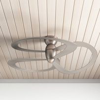 a white ceiling fan mounted to the side of a wooden ceiling in an empty room