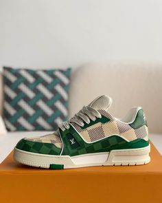 Embrace iconic style with a contemporary twist in these Louis Vuitton Trainer-inspired sneakers. The classic low-top silhouette is reimagined with a vibrant green and white colorway, featuring the signature Damier canvas for a touch of luxury. Crafted with meticulous attention to detail, these sneakers offer a premium look and feel, perfect for those seeking a statement piece that seamlessly blends streetwear edge with high-fashion inspiration. Trendy Green Leather Sneakers, Luxury Green Sneakers With Branded Insole, Luxury Green Sneakers For Streetwear, Modern Green High-top Sneakers With Round Toe, Modern Green Lace-up High-top Sneakers, Designer Sneakers For Streetwear With Rubber Waffle Outsoles, Modern Green High-top Sneakers With Rubber Sole, Modern Green High-top Sneakers With Abzorb Midsole, Designer Green Lace-up Sneakers