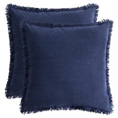 two dark blue pillows with fray edges