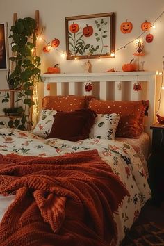 a bedroom decorated for halloween with pumpkins on the wall and lights strung from the ceiling