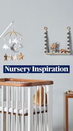 a baby crib in a nursery room with stars and moon decorations on the wall