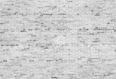 black and white brick wall textured with gray paint, suitable for use as background or backdrop