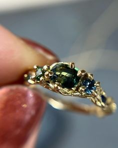 This is one of my favorite stones to work with, but I’m not sure the photos really do it justice. A Montana Sapphire with a perfect bicolor… | Instagram Color Changing Sapphire, Bicolor Sapphire Ring, Raw Sapphire Engagement Ring, Green Saphire Ring, Bicolor Sapphire, Boho Engagement Ring, Montana Sapphire Ring, Raw Gemstone Ring, Earthy Jewelry