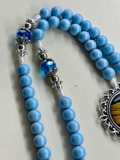 Blue Beaded Rosary As A Gift, Handmade Blue Rosary For Jewelry Making, Spiritual Rosary With Large Beads As Gift, Adjustable Blue Beaded Rosary, Blue Crucifix Necklace For Spiritual Wear, Blue Crucifix Necklace For Spiritual Purposes, Blue 108 Beads Spiritual Rosary, Spiritual Blue Rosary With 108 Beads, Gift Beaded Rosary