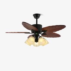 a ceiling fan with three light bulbs on it's blades and two leaves attached to the blade