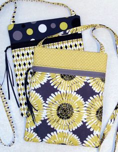 three purses are sitting next to each other on a white surface with polka dots