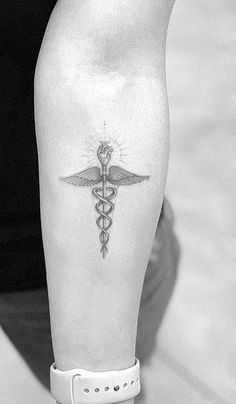 a black and white photo of a person's leg with a medical symbol on it