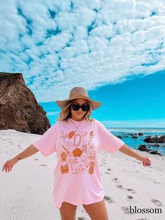 Trendy Hawaiian-inspired t-shirt, featuring aesthetic elements perfect for beach days.  Add a touch of island vibes to your wardrobe with this cute summer tee. * Comfort Colors 1717 Garment dyed Unisex T-shirt * Medium fabric (6.1 oz/yd² (206.8 g/m * Relaxed fit * 100% ring-spun cotton == PRINT == We use Direct-to-Garment printing, no cracking or peeling, unlike vinyl.  The ink is printed into the fabric, providing a lasting and vibrant finish. ==  RETURNS OR EXCHANGES ==  Since each shirt is cu Tropical Graphic Print T-shirt For Beach, Pink Summer T-shirt For Vacation, Trendy Short Sleeve T-shirt For Vacation, Pink Tops For Beach Vacation, Pink Tops For Vacation And Beach Season, Pink Top For Vacation And Beach Season, Relaxed Fit Summer T-shirt For Beach Party, Vsco Style Beach Tops For Vacation, Tropical Graphic Print T-shirt For Vacation