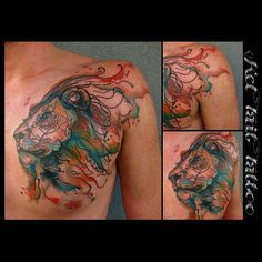 some tattoos on the back of a man's shoulder and chest are painted with different colors