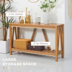 a wooden shelf with 2 tier shelves and two storage spaces on each side in front of a white wall