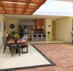 an open concept kitchen and dining room with wood flooring, ceiling fan and wooden table surrounded by chairs