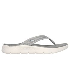 Breezy style and carefree comfort combine in Skechers GO WALK Flex Sandal - Overjoy. This thong style sandal features a quilted mesh upper with a contoured Goga Mat footbed and lightweight ULTRA GO cushioning. | Skechers Women's GO WALK Flex Sandal - Overjoy Sandals | Medium Width | Contoured Goga Mat comfort footbed | Lightweight, responsive ULTRA GO cushioning | Crafted with 100% vegan materials | Quilted mesh strap upper | Flexible traction outsole | Machine washable | Skechers Skechers Sandals, Skechers Women, Wide Shoes, Personal Marketing, Shopping Hacks, Grey Fashion, Perfect Pair, Walking, Sandals