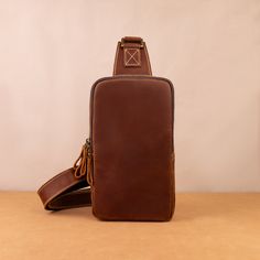 Men's Leather One shoulder bag Crossbody Bag Backpack for men Leather Shoulder Bag Messenger Bag For Men ◾PRODUCT INFORMATION --------------------------------------------- --Product Size:  - 25x14x7cm - 9.84x5.51x2.75 in --Item Weight: 0.5 kg/1.1Pounds --High-Quality & Density Stitching On the back of the crossbody bag are two hooks for both the left and right shoulders --FEATURES-- This leather messenger bag exudes an irresistible charm with its unique design and exceptional craftsmanship. Carefully constructed by skilled artisans, this bag embodies the perfect blend of functionality, durability, and minimaliste style. The bag is expertly fashioned from the first-layer cowhide, chosen for its natural beauty and remarkable resilience. Its rich hues and subtle variations in the leather's gr Brown Travel Belt Bag, Portable Brown Leather Belt Bag, Brown Rectangular Chest Bag For Everyday Carry, Rectangular Brown Chest Bag For Everyday Carry, Functional Brown Rectangular Chest Bag, Brown Belt Bag With Adjustable Strap For Outdoor, Outdoor Chest Bag With Adjustable Strap, Durable Chest Bag For Outdoor Activities, Brown Chest Bag For Everyday Carry With Phone Pocket