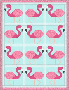 a quilted pattern with pink flamingos in the middle and blue squares around them