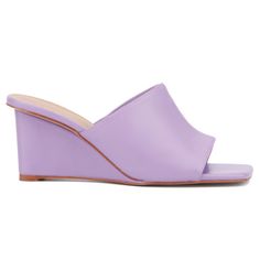 Whether you're heading out for a night on the town or enjoying brunch with friends, the Candie has you covered. This open-toe mule features a chic wedge that combines style with comfort, making it perfect for all-day wear. The versatile design effortlessly complements any outfit, ensuring you look fashionable from day to night. With its blend of elegance and practicality, the Candie is a must-have addition to your wardrobe, offering both sophistication and ease for any occasion. Summer Open Toe Slides With Deep Heel Cup, Chic Spring Wedge Sandals With Open Heel, Chic Spring Open Heel Wedge Sandals, Spring High Heel Wedge Sandals With Stacked Heel, Summer High Heel Mules With Deep Heel Cup, Summer Slide Heels With Stacked Heel, Open Toe Slides For Spring Parties, Spring Evening Wedge Sandals With Stacked Heel, Modern Summer Wedge Heel Slides