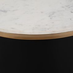 The York Coffee Table is an exquisitely crafted amalgam of metal, marble, and high-quality manufactured wood. Its modern design can be seen in its chunky cylinder shape and black iron base, balanced by a striking white top. Elegant and sophisticated, it is an eye-catching piece that adds a touch of timeless luxury to any living space. Dimensions: L 31" x 31" W x 17" H Coffee Table Frame, Pedestal Coffee Table, Round Coffee Table Modern, Metal Cylinder, Coffee Table Black, Drum Coffee Table, Accent Seating, Credenza Sideboard, Table Frame