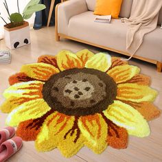 a living room with a flower rug and slippers on the floor next to it