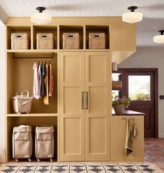 an organized closet with baskets and clothes hanging on the wall, along with other items