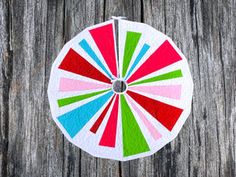 an image of a colorful pinwheel on wood