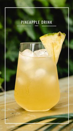 a pineapple drink in a glass on a table