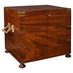 an antique wooden chest with brass handles