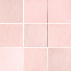 a white and pink tiled wall with small squares