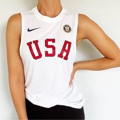 Size Large Nike Usa Muscle Tank Top. Loose Fit With Low Cut Arm Holes. Meant To Be Worn With A Sports Bra. Features Usa Olympic Patch, Red Usa Letters Across Front. Material Of Top Is Super Soft Feeling. This Is Brand New And Never Been Worn. My Husband Bought Me Wrong Size And It Passed The Return Window. Gear Up To Support Team Usa In The Next Olympics (La Will Host Next One!) Or It’s Just A Great Patriotic Shirt To Show Your American Pride. White Muscle Tee, Usa Olympics, Muscle Tank Top, Patriotic Shirt, Soft Feeling, Muscle Tank Tops, Muscle Tee, Patriotic Shirts, Team Usa