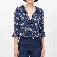 Realisation Par Blue Silk Floral Ruffled Blouse Size S Floral Print Pattern Ruffled Blouse, Ruffled V-Neck Single Snap Button Closure At Front ¾ Sleeves With Ruffled Cuffs Ruffled Hem Gathered Shoulders Navy / Midnight Blue Base With White And Black Floral Print Throughout Unlined Approximate Measurements (Laid Flat): Brand: Realisation Par Size: Small Color: Midnight Blue, Black, White, Red P2p: 17” Length: 16 ½” Sleeve: 17” Material: 100% Silk Condition: Pre-Owned; Excellent Pre-Loved Conditio Blue Ruffled Tops For Office, Blue Office Blouse With Ruffles, Spring Office Wear Ruffled Blouse, Blue Ruffled Tops For Formal Occasions, Spring Office Wear Blouse With Ruffles, Formal Blue Ruffled Tops, Spring Office Wear Tops With Ruffles, Formal Blue Floral Print Tops, Business Casual Boho