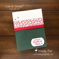 a christmas card with the words live in canada written on it and an ornament