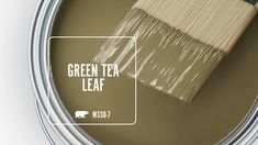 a can of green tea leaf paint with a brush in the top right hand corner