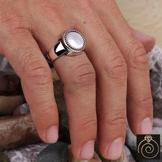 Men's mother of Pearl gemstone signet ring which will give you a head turning presence. This mystic, vintage style, engraved ring has a unique design for the polished, refined, and distinguished man. Perfect for casual and formal events, it will make your friends envious as you walk into the room full of confidence and pride. Looking for a unique, one of a kind GIFT FOR HIM, groomsman gift, father's day gift, teacher day gift? Look no further. This cool gemstone ring is the right answer and best Men Rings Silver Stones, Pearl Ring Designs Silver Men, Pearl Ring Design For Men, Pearl Rings For Men, Mens Gemstone Rings Unique Gold, Unique Ring Designs For Men, Spiritual Silver Signet Ring For Wedding, Spiritual Round Signet Ring With Polished Finish, Spiritual Signet Ring With Polished Finish