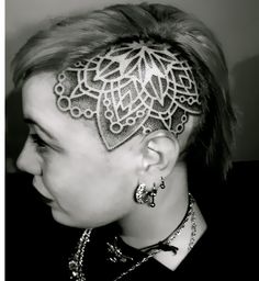 a woman with a tattoo on her head