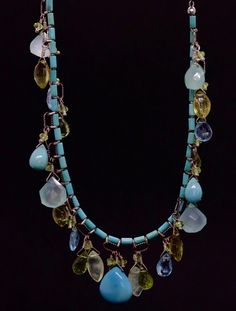 Amazing Laura Gibson Necklace. Sterling Silver Links and Closure. Sweet candy gems dangling in an artistic manner. Following gems are present: Apatite, Peridot, Opal Chalcedony, Lemon Topaz, Turquoise and Prehnite.. Condition: Shows no Wear. Details: 17in length 20.1 grams total weight Turquoise Briolette Gemstone Bead Necklaces, Turquoise Briolette Gemstone Necklace, Turquoise Gemstone Dangle Necklaces, Fine Jewelry Turquoise Necklace With Gemstone Accents, Green Multi-stone Dangle Jewelry, Blue Multi-stone Necklace For Jewelry Making, Bohemian Multi-stone Dangle Jewelry, Unique Turquoise Necklace With Gemstone Accents, Multi-stone Dangle Gemstones For Jewelry Making