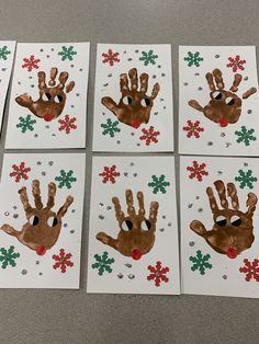 four handprints with christmas decorations on them