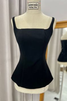 The top is a chic sleeveless top featuring on-trend peplum detail at the waist. Made from ultra-soft black velvet fabric, this stretch top accentuates curves with its strappy square neckline and flared peplum hem. Edgy yet elegant, this peplum top is perfect for both day and night seasonal looks. Corset Peplum Top, Black Velvet Fabric, Mean Blvd, Velvet Top, Stretch Top, Peplum Hem, Lace Midi, Lace Midi Dress, Velvet Tops