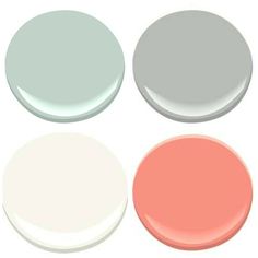 four different colors of paint on a white surface with one light pink, the other pale