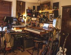 a room filled with musical instruments and guitars