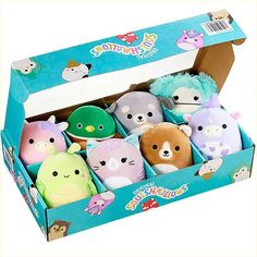 the stuffed animals in the box are different colors