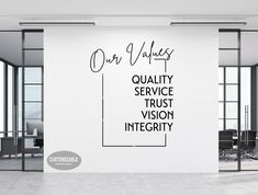 an office wall with the words quality service trust and vision integity written on it