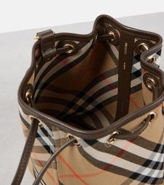 Find BURBERRY Check Jacquard Bucket Bag on Editorialist. This Burberry bucket bag is crafted from Burberry check jacquard fabric. It features a drawstring closure, an adjustable shoulder strap, and a dust bag. It is made in Italy. Burberry Bucket Bag, Burberry Tote Bag, Burberry Tote, Beige Bag, Mini Bucket Bags, Drawstring Bucket Bag, Mini Bucket, Jacquard Fabric, Burberry Bag