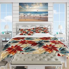 a bedroom with white walls and flooring has a large bed covered in colorful flowers