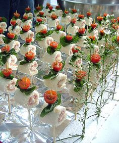 there are many small trays with food on them that is decorated to look like flowers