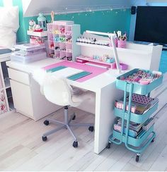 a desk with lots of crafting supplies on it in the corner of a room