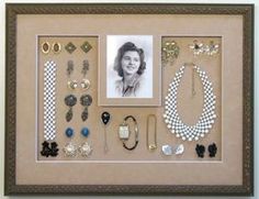 a framed photo with some jewelry on it