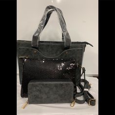 New 3 Piece Set. Set Of 3. Faux Leather Pvc. Dark Gray Large Bag- 14” X 10” Center Opening W/ 2 Slide Pockets On Inside Front One 3 1/2" Long Other Is 4 1/2" Long Both Are 4" Deep. Inside Back Has 6 1/2" Long Pocket That Is 6" Deep. Removeable Adjustable Shoulder Strap Is 25” To 43". Handles Have 7" Drop. Black Sequins Bag 10 1/2" X 8". Large Center Pocket. Large Inside Slide Pocket 7 1/2" X 4". Inside Back Has Large Zipper Pocket 6 1/2" X 5 1/2". Removable Wrist Strap / Gray Wallet-8 C/C Cash P Gray Rectangular Bag With Gunmetal Hardware, Gray Bags With Gunmetal Hardware For Daily Use, Elegant Gray Bags For On-the-go, Inside Slide, Sequin Bag, Bag Dark, Handbag Black, Coach Swagger Bag, Large Bag