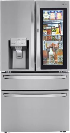 a silver refrigerator freezer sitting next to an icebox and water dispenser